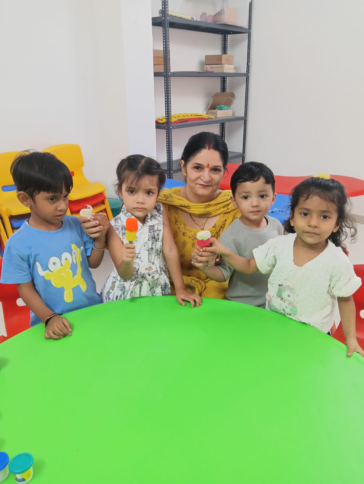Senior K.G. students doing a craft activity at Lily Lotus Preschool Becharaji