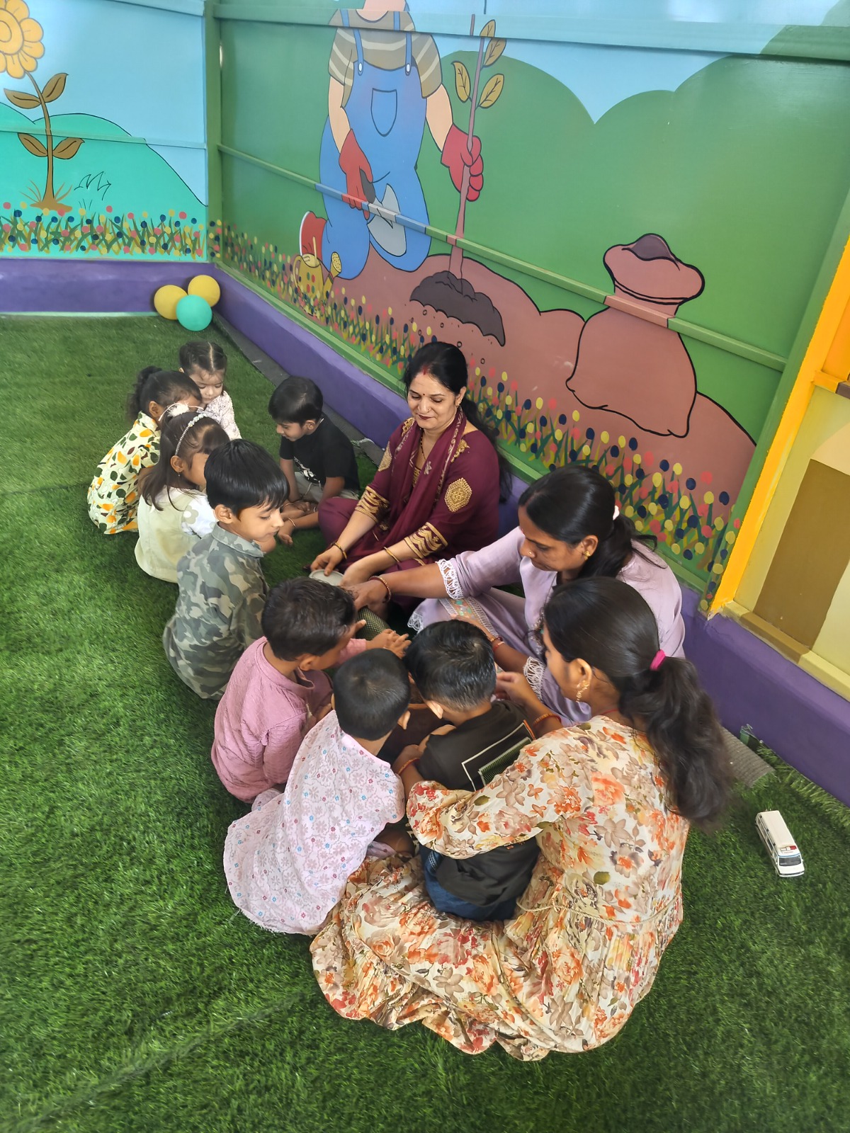 Students and teachers gathered for circle time outdoors